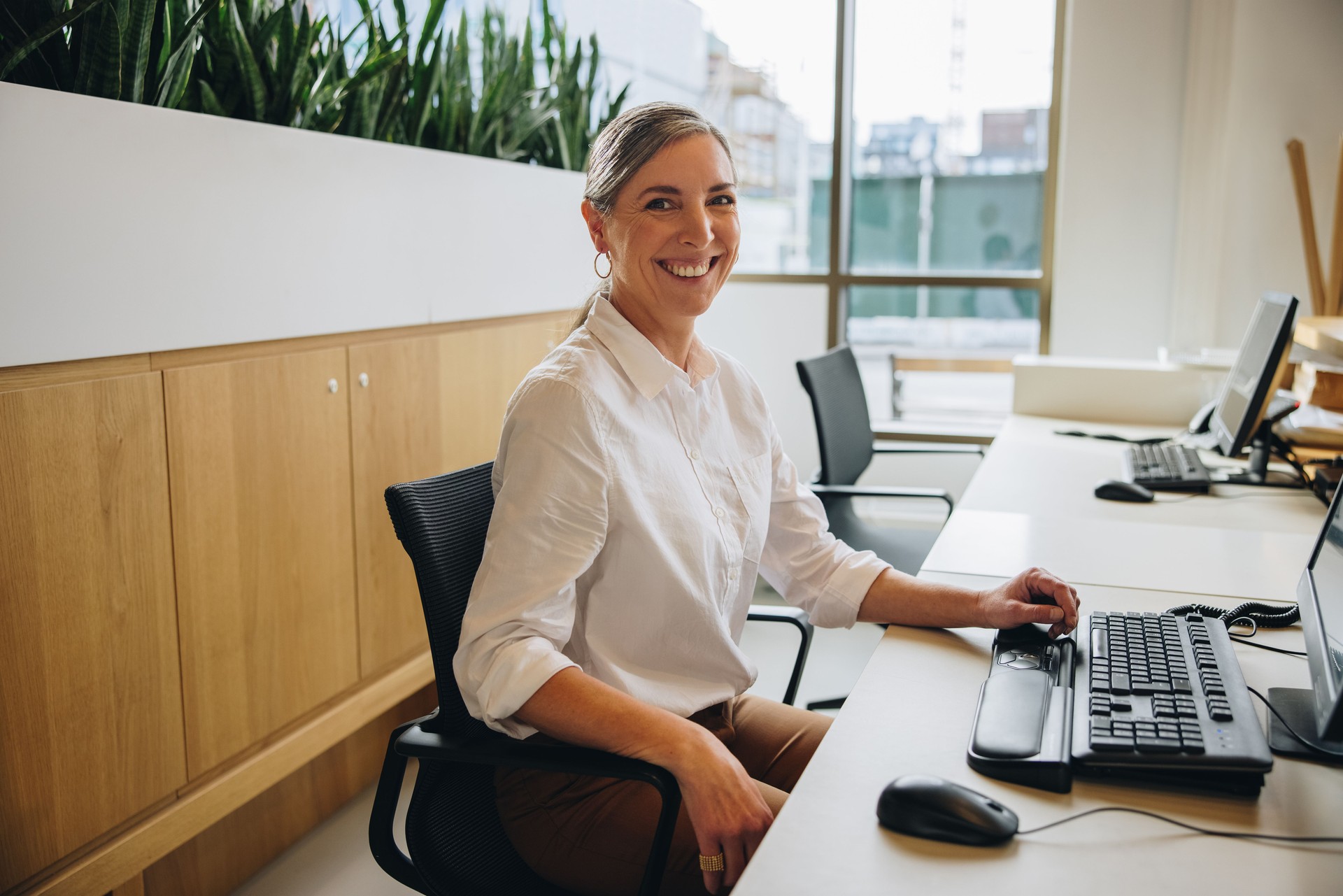 Friendly receptionist working in office